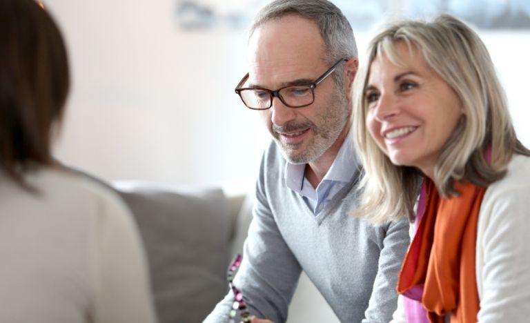 Couple listening to financial planner